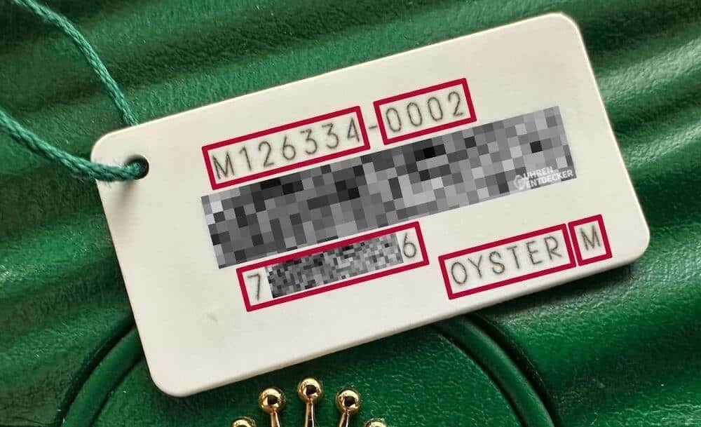 Rolex weißes Hangtag Informationen Uhr Zahlencodes Seriennummer Boxgröße